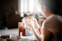 Child Feeding a Baby 