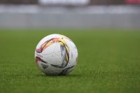 Soccer ou Adidas soccer ball on a grass pitch soccer,football,sport