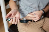 Diabetes medication Close-up of an insulin injection being taken for Type 1 diabetes in South Africa. south africa,port elizabeth,white man