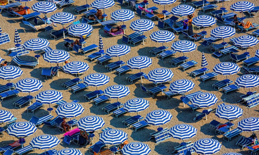 Vacations Holidays Beach in white and blue tourist,umbrella,sunshade