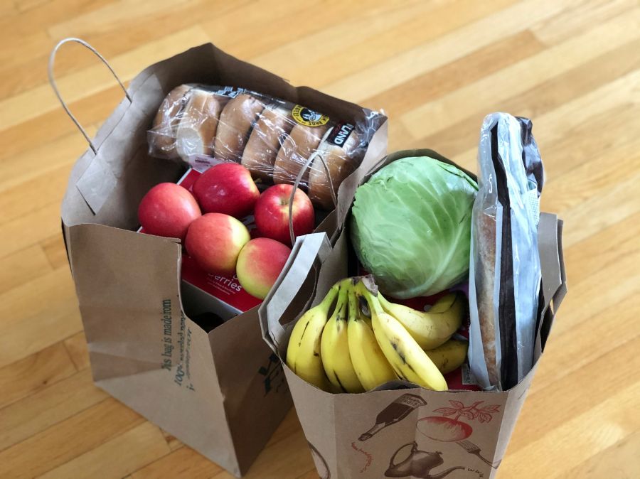 Grocery shopping Paper bags with groceries including fruits and vegetables and bread food,banana,paper bags