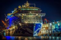 Cruise ship I was out on the water taking photos of the supermoon rising and was returning to the marina when I noticed this lovely image of Regal Princess all lit up and reflected in the glass on the pier. 