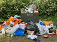 Litter waste Bags of rubbish discarded on Putney Common. Residents’ use of the common during COVID lockdown increased hugely, with picnic of pizza and beer gaining popularity, resulting in piles of plastic bags of the resulting rubbish.  litter,london,putney common