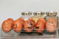 Emotion A photograph (wallpaper, picture) of eggs with different emotions against a background of blurred spices and a smooth gray wall.  Whole painted eggs in the kitchen, expressing a spectrum of emotions from sadness to joy or madness. Eggs with smile and crazy face. россия,приморский край,золотая долина