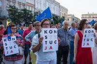 Populist Coalition Polish protesters. Many of the protesters are holding signs that read “KONSTYTUCJA,” which is the Polish word for “Constitution.” Some of the signs have certain letters highlighted, which is a common symbol used in Polish protests advocating for the defense of the constitution. poland,human,person