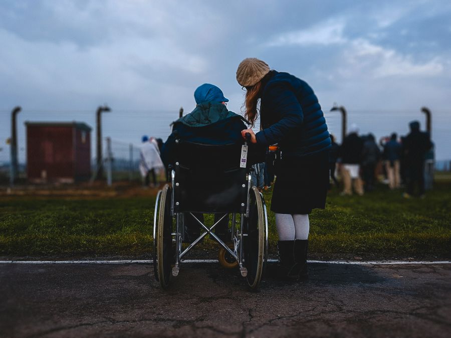 Disability This is Siggy Weiser. He is a Holocaust survivor. 75 years later he is back watching Jewish youth praying in the death camp Auschwitz, Mr. Weiser’s previous residence, where he was threatened with death daily. people,wheelchair,auschwitz