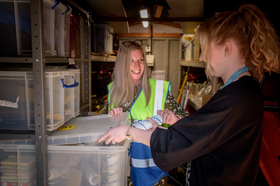 Firefighters Warehouse Two women working in a stock cupboard. warehouse,storeroom,store