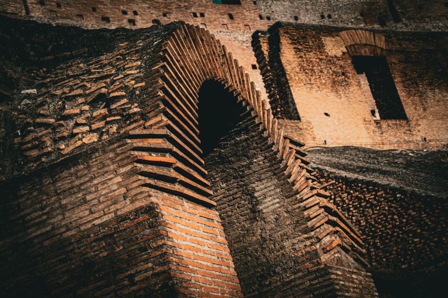 Craftsmanship Ancient red brick wall showcasing history and craftsmanship. Timeless structure, full of character and charm, with every brick telling a story of the past. A true architectural wonder. 