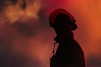 Wildfires Firefighters firefighter silhouette with smoke and light 