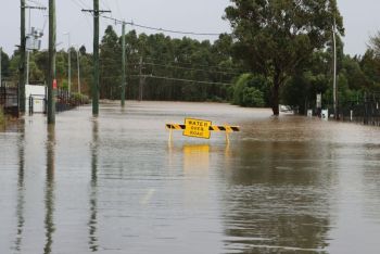 Flood damage Flooded road near Windsor, Western Sydney, NSW, Australia. July 5, 2022 