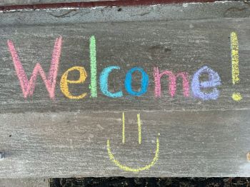 Welcome Day Welcome written with chalk