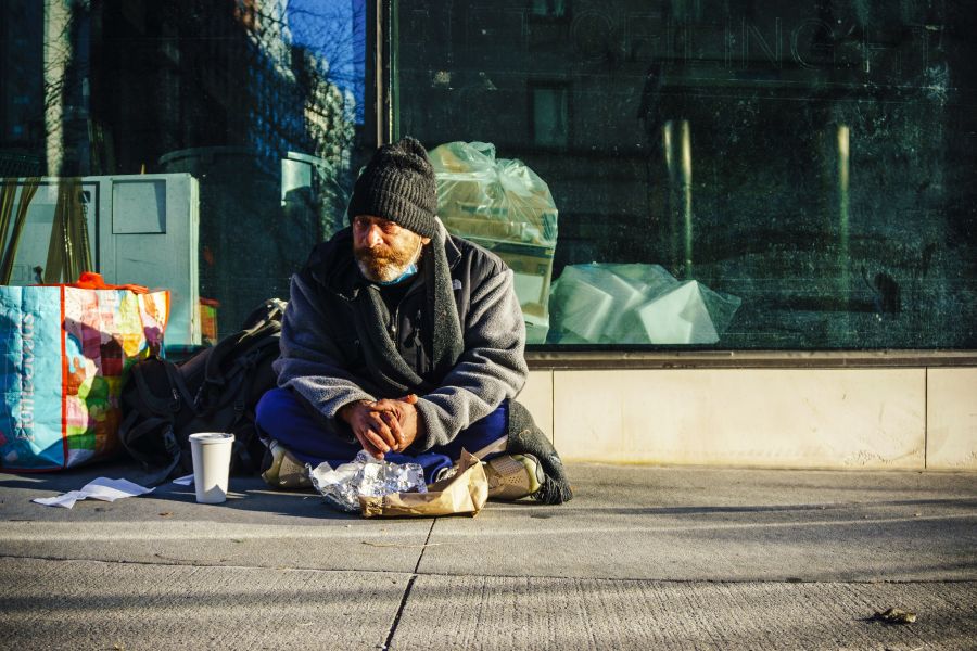 Homelessness A homeless man eats breakfast on the street on Upper East Side of Manhattan. 