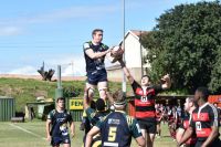 rugby match Young men playing rugby and catching the ball in the line-out. Lock lifting a jumper high into the air.  rugby game,youth,game