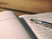 journalism writer Fountain pen on a journal 