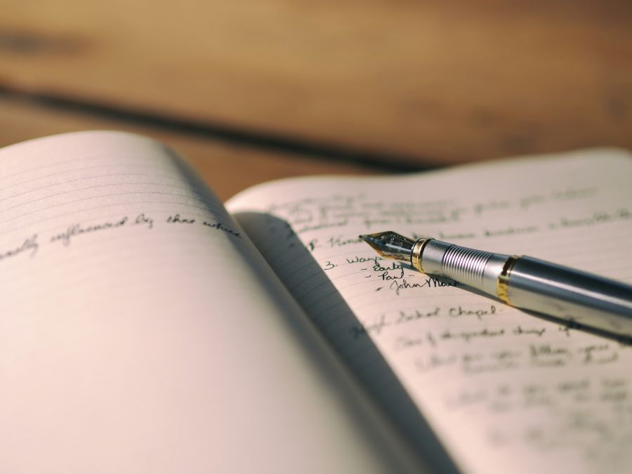 journalism writer Fountain pen on a journal 