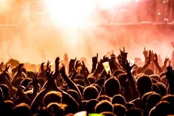 music culture Crowd of people cheering at a live concert 
