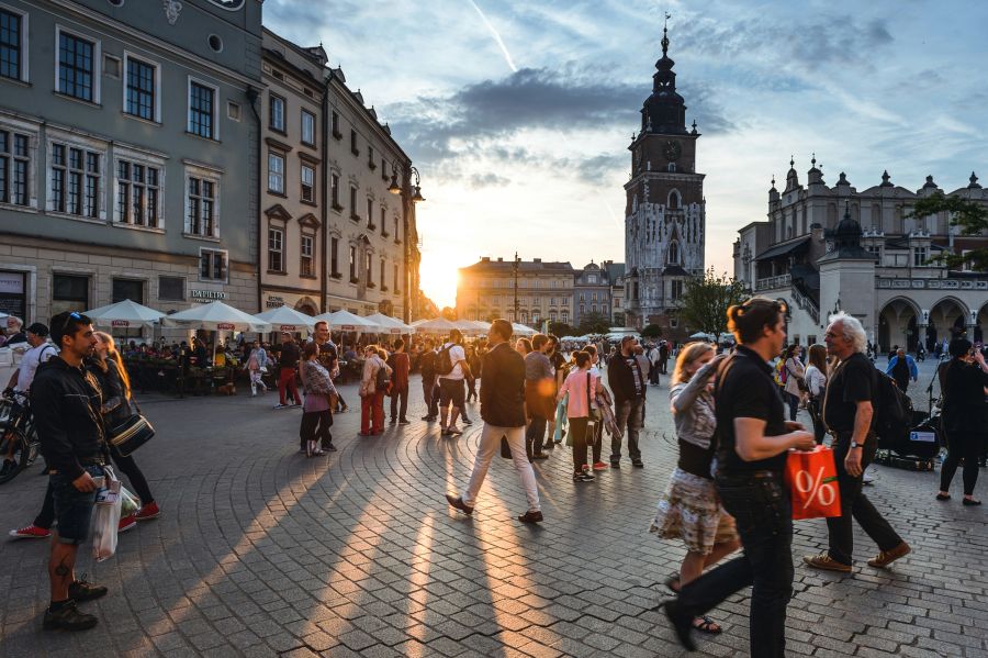 tourism Tourists on Main Market Square in Krakow, Poland. 