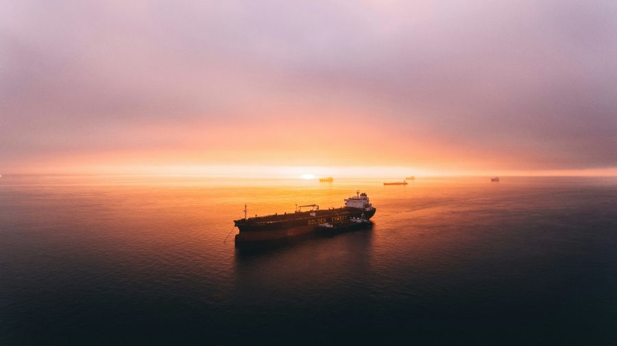 Ship pirate This was taken one morning as part of a distance test flight. I wanted to see how far I could push the drone out into San Francisco Bay and the weather conditions were perfect. There was no wind, and zero signal interference and this shot was 2.8km into the bay. It wasn’t until I got home and started to edit that I saw the ship was called Golden Energy. It seemed more than perfect with the sunrise lurking on the horizon. ship,sunset,bay