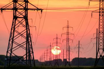 Energy transition power line NP background of the sunset, a lot of supports for wires 