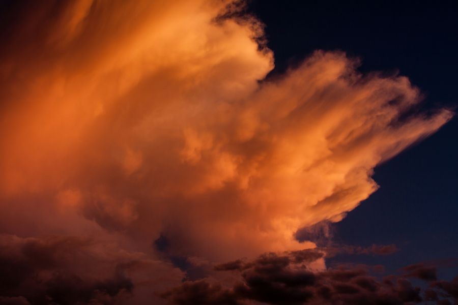 Montpellier weather Wind blown cloud tops in the setting sun.  weather,climate,brown