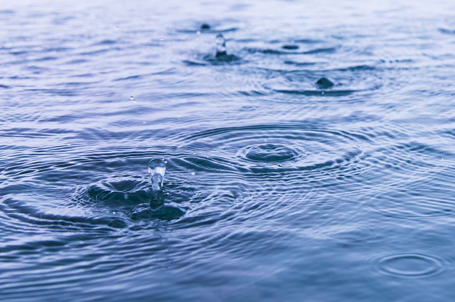 Rain Weather Rain droplets in pool, close up. water,ripple,water surface