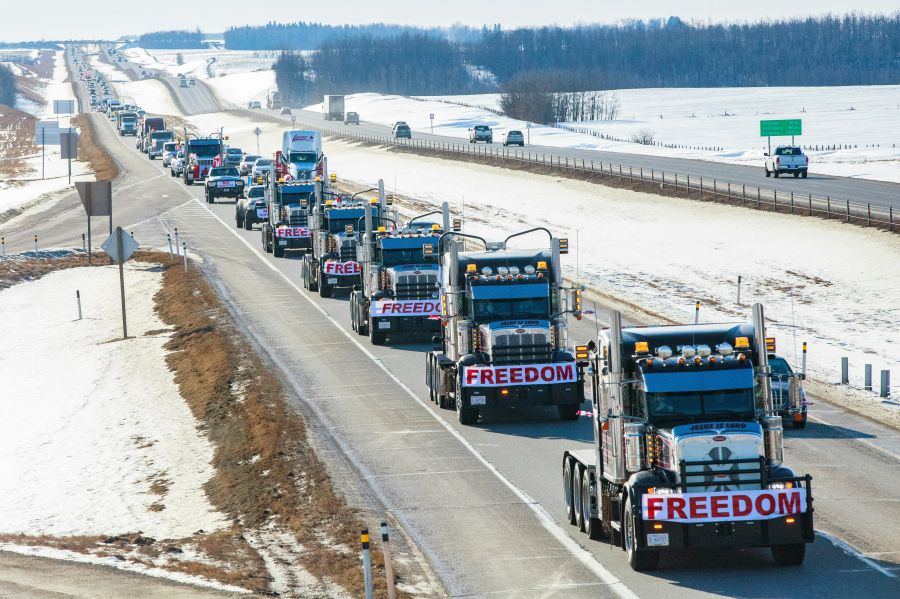 convoy FREEDOM convoy taken in Central Alberta, Queen Elizabeth Highway 2 on the way to the Legislature Building in Edmonton. This demonstration was in support of the FREEDOM, Anti-mandate Protest, with Truckers demonstrating in Ottawa, Ontario, Canada. Taken by Naomi McKinney, McKinney Psychology. Please link back to my webpage should you use this photo. mckinneypsych.com