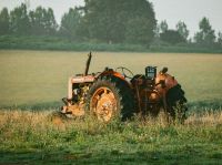 tractor accident Vintage Nuffield tractor in a field 
