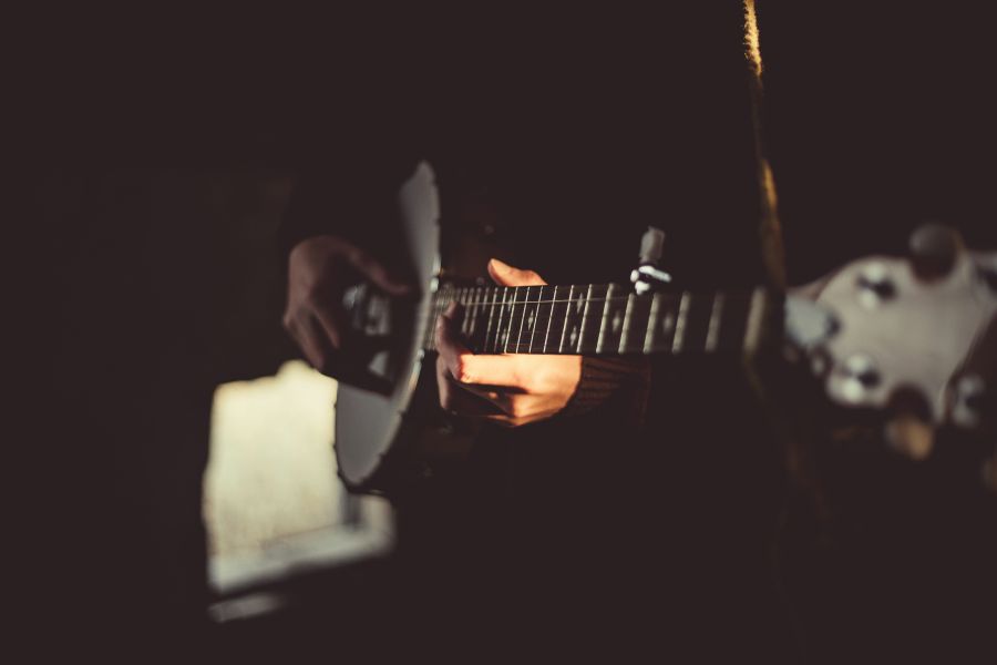 Music Passion Banjo player in a dark room music,guy,stringed instrument