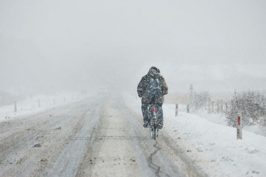 Rain Grey A typical dutch picture: A cyclist a snowstorm. In the snow storm in febuary i snoticed this cyclist on the main road on Ameland. grey,ameland,netherlands