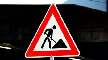 Road works Road sign: construction ahead. For whatever is under construction or work in progress :-)  