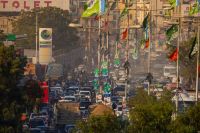 Election City An urban symphony of wires, banners, traffic, and Karachi’s everyday chaos. 