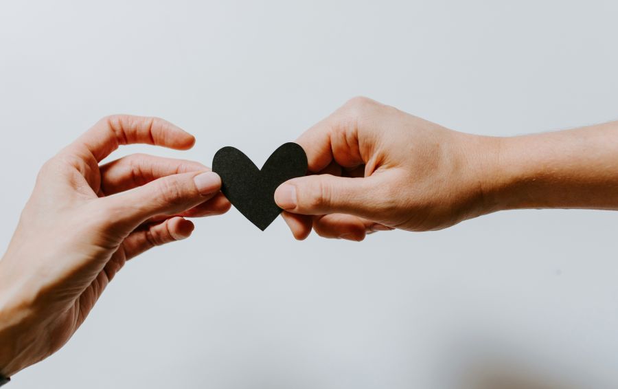 widow support man and woman holding a heart together love,hands,relationship