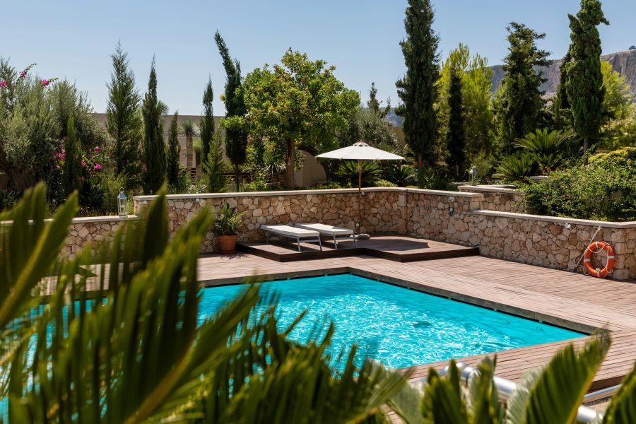 Pool White umbrella near an outdoor swimming pool. pool,blue,luxury