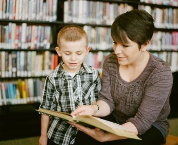 Literacy Education Mother reading to her son as he listens intently. Books in the background are slightly blurred creating the perfect atmosphere to instill a lifelong love of reading. The 3 - 6 year old boy is engaged, happy, the moment is captured in this photo creating a lifelong memory. 

https://www.awcreativeut.com
https://www.instagram.com/AwCreativeUT/
https://www.citystorageif.com/
https://www.etsy.com/shop/AwCreativeUT

#AwCreativeUT #awcreative #AdamWinger  