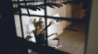 Teenage struggle Young teenage girl dancer crying and tearing book sits on floor in hall 