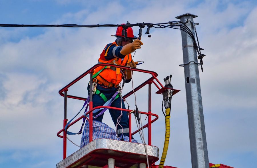 Power outage An electrician is repairing the power line  electricity,pylon,dangerous