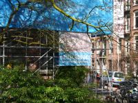 Street renovation Photo of a house facade in renovation with scaffolding and blue building canvas. It is a sunny day in early Spring in a street in the Plantage district in Amsterdam city with much light and shadows. Free image of street photography of Amsterdam, photos of constructions in big cities in The Netherlands by Dutch photographer Fons Heijnsbroek. amsterdam,netherlands,free pic