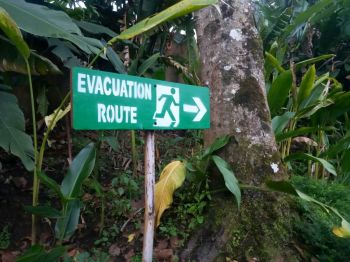 Travelers Evacuation Route signs for evacuation directions