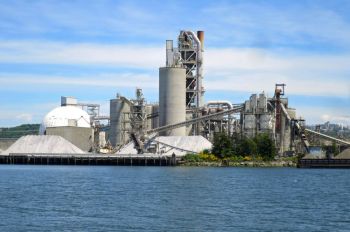 Cement factory An industrial cement plant on the banks of a river.
