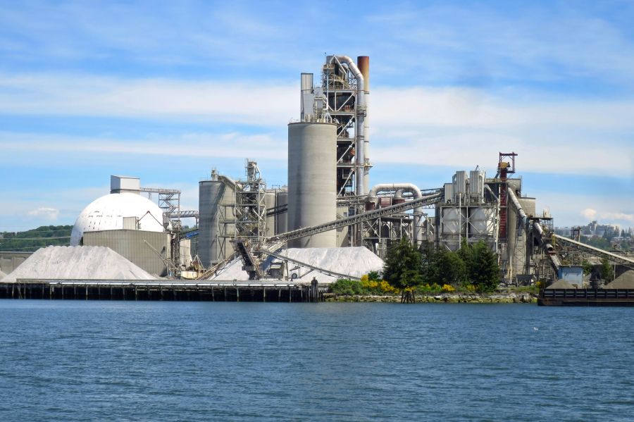 Cement factory An industrial cement plant on the banks of a river. 