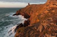 strong winds Rough seas from the cliff path looking towards MP3 Tower at Les Landes, St. Ouen, Jersey, Channel Islands 