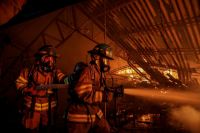 Firefighters action Images of a structural fire in a textile factory in Soyapango, San Salvador. 