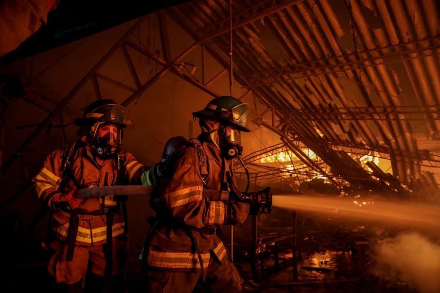 Firefighters action Images of a structural fire in a textile factory in Soyapango, San Salvador. 