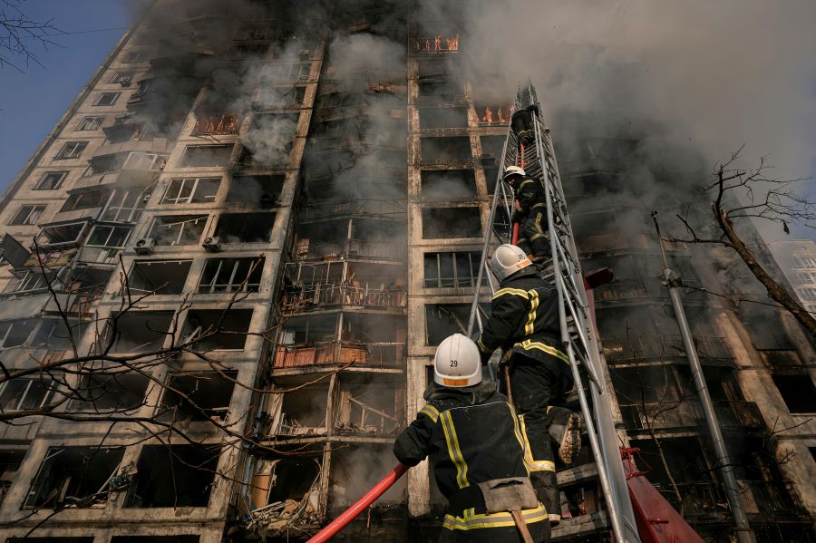 Firefighter Hero Firefighters spraying high pressure water to burning house. Conflagration. Ukraine. helmet,fireman,fire