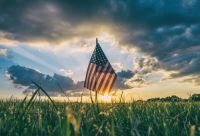Veterans American flag in the grass 