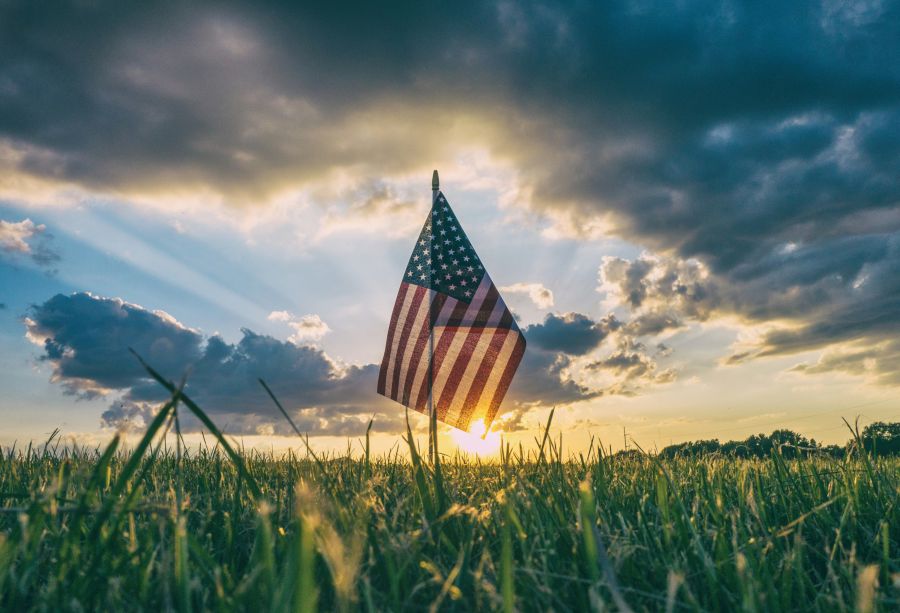 Veterans American flag in the grass 