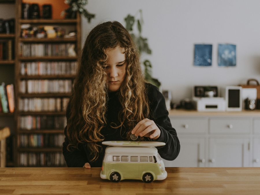 Emergency Fund Girl putting coin into moneybox invest,fund,finance