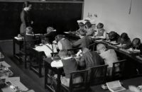 Classroom segregation 	Glance into a classroom, 1935 classroom,school,caucasian