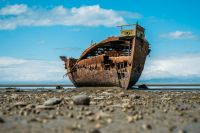 Shipwreck Abadoned boat on shore. new zealand,motueka,janie seddon shipwreck