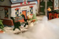 Christmas village Miniature snowman in a miniature Christmas village. snow,texas,united states
